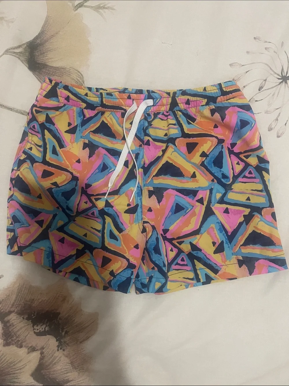 chubbies Kids Neon Geometric Swim Trunks in Pink, Blue, Yellow, Black